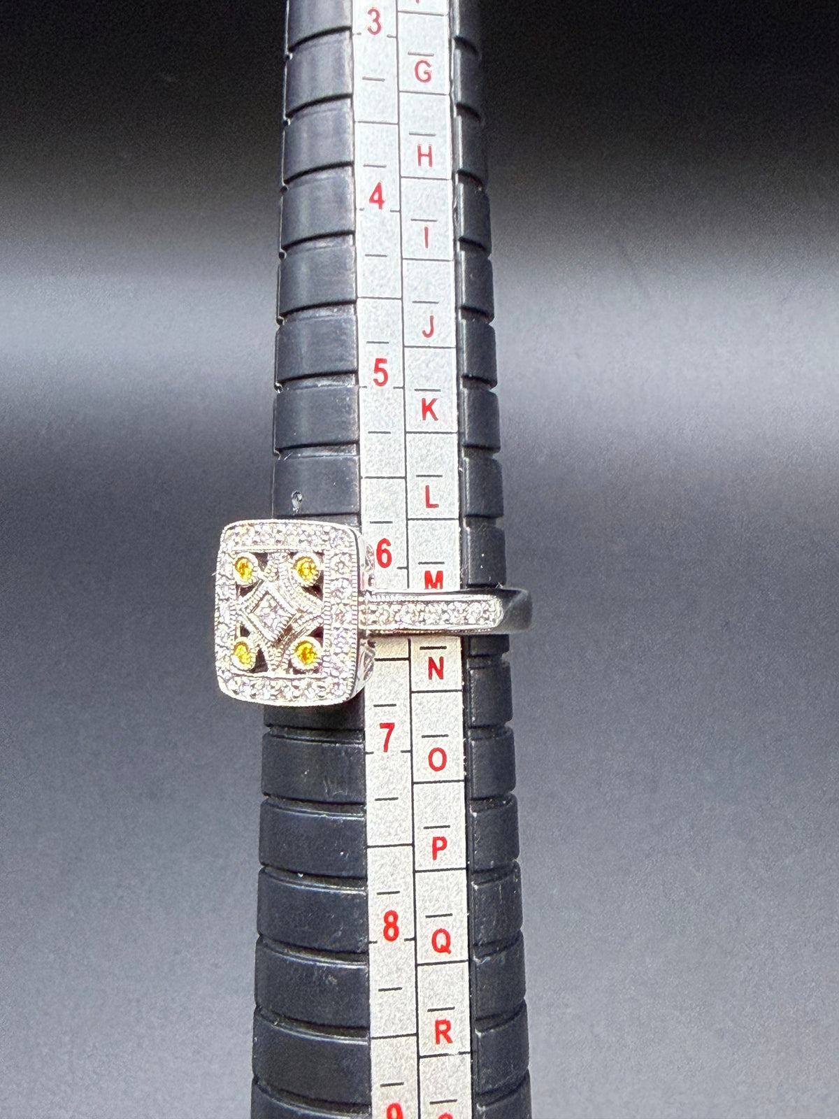V and Co 18ct white gold Art Deco diamond panel ring, size M and a half