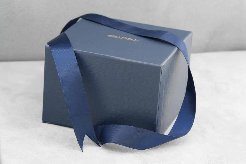 Chapman Gold navy presentation box with ribbon