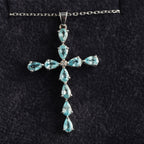 9ct white gold sky blue topaz cross pendant, hallmarked (display chain not included)