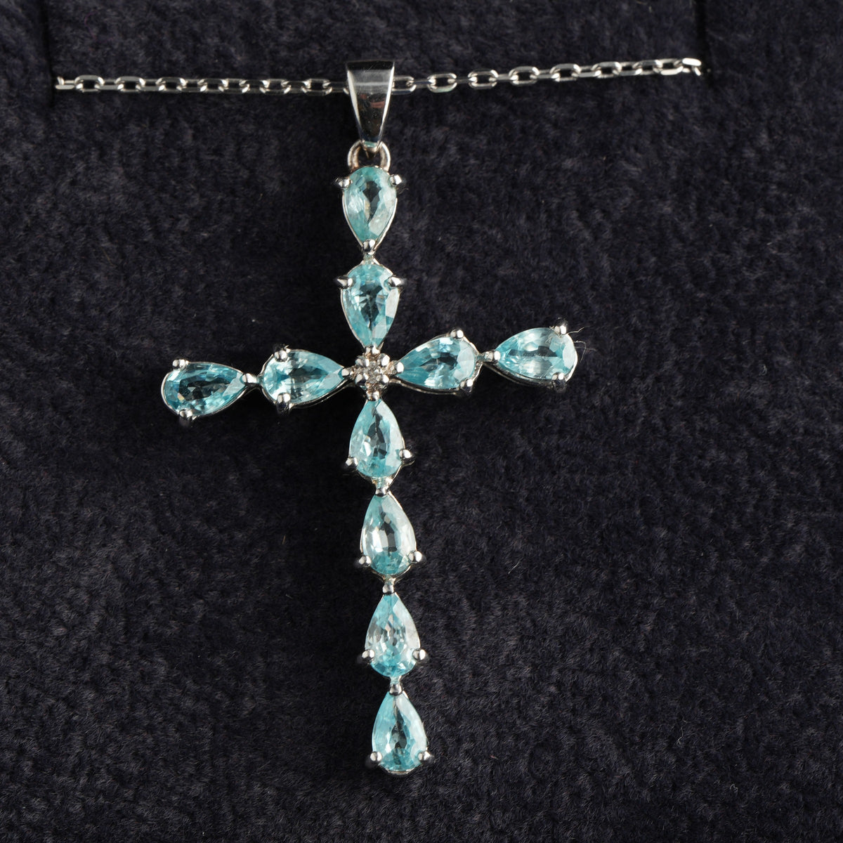 9ct white gold sky blue topaz cross pendant, hallmarked (display chain not included)