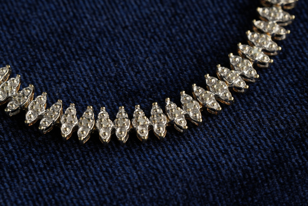 9ct gold diamond line bracelet, 68 brilliants, Sheffield hallmarked, 19.5 cm