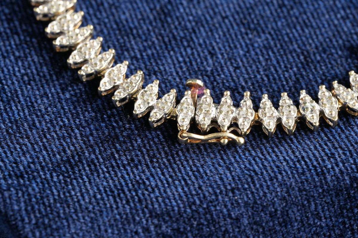 9ct gold diamond line bracelet, 68 brilliants, Sheffield hallmarked, 19.5 cm