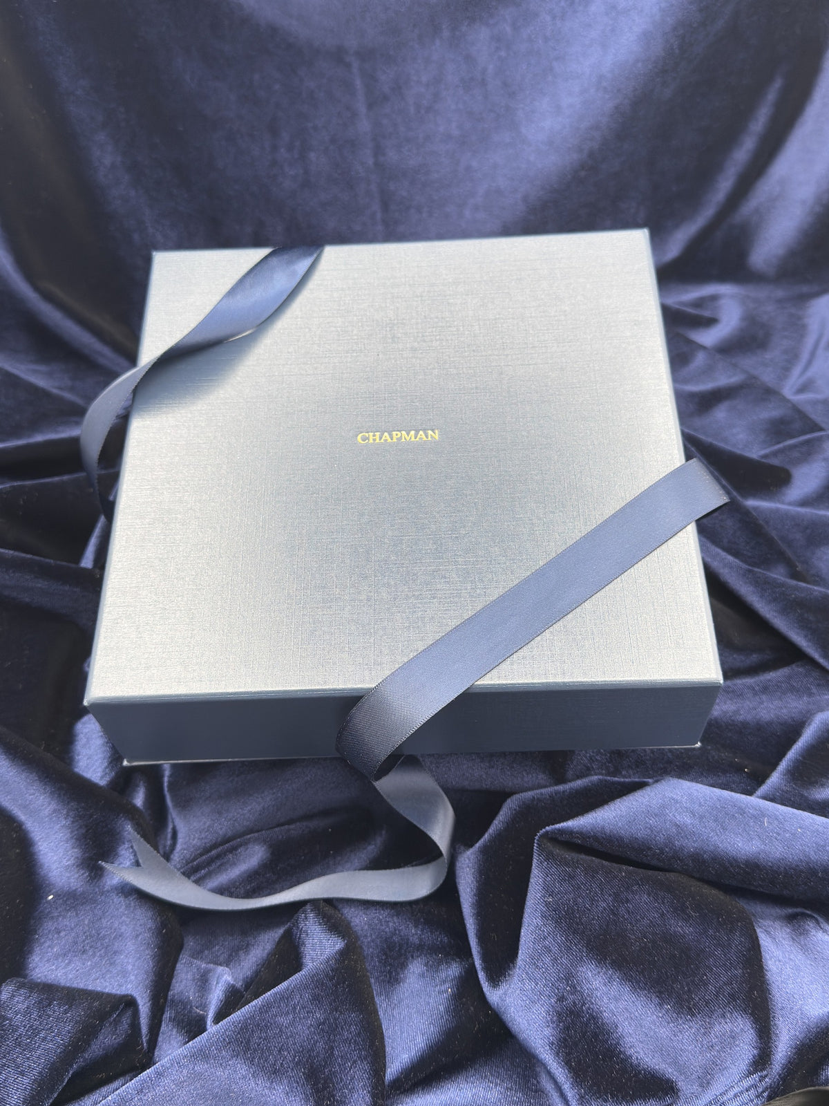 Chapman Gold navy presentation box with ribbon
