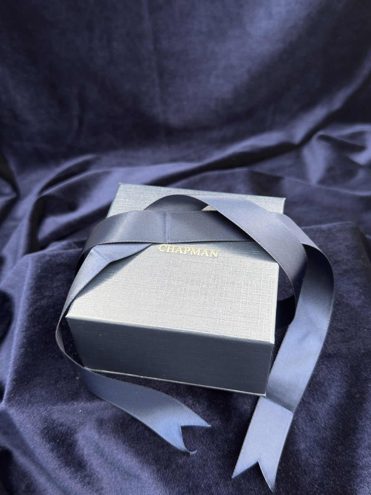 Chapman Gold navy presentation box with ribbon
