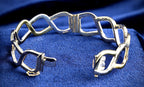 Pobjoy 9ct yellow and white gold hinged openwork bangle, 18.17 g, Sheffield hallmarked