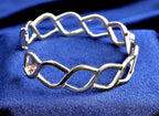 Pobjoy 9ct yellow and white gold hinged openwork bangle, 18.17 g, Sheffield hallmarked