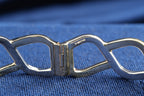 Pobjoy 9ct yellow and white gold hinged openwork bangle, 18.17 g, Sheffield hallmarked