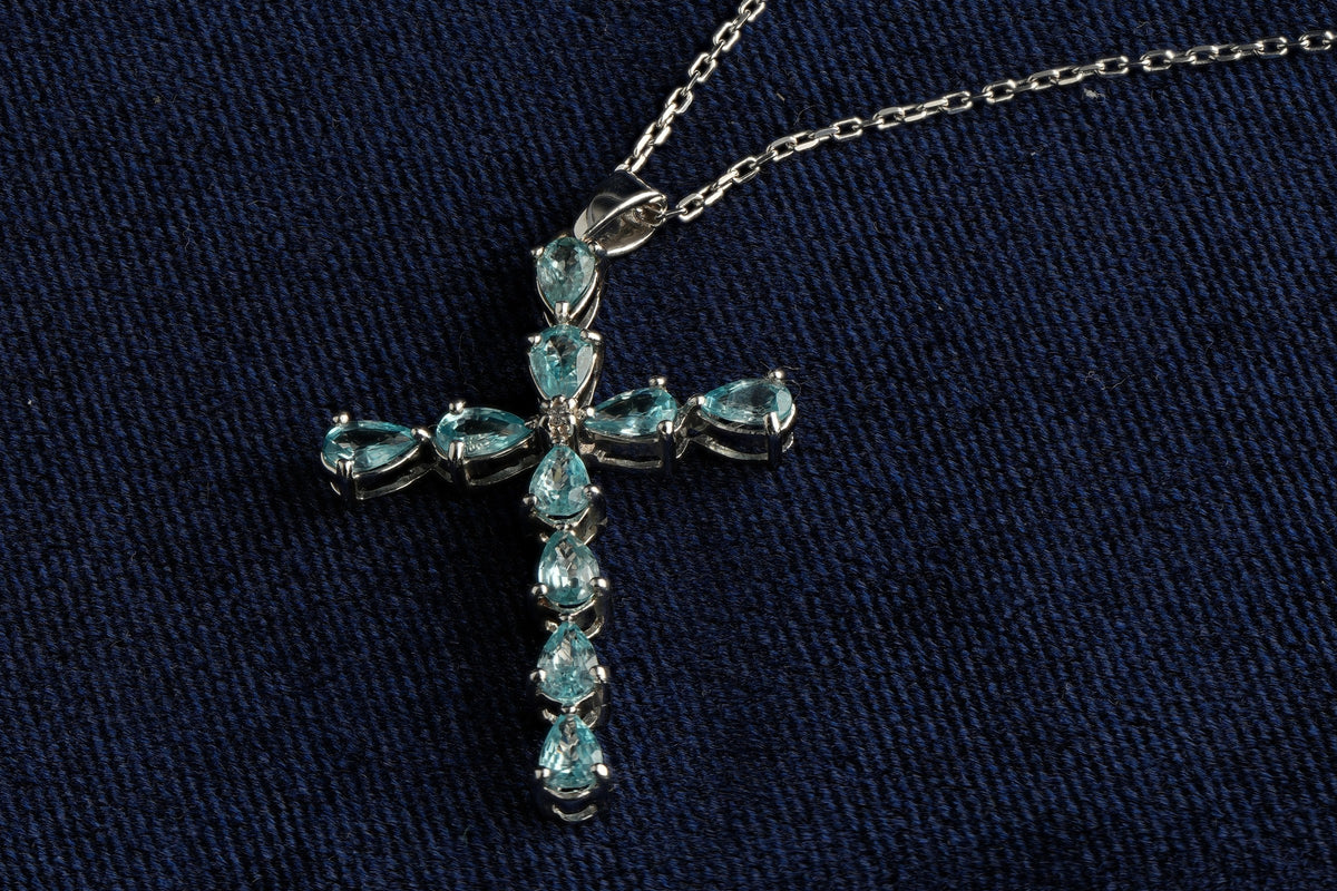9ct white gold sky blue topaz cross pendant, hallmarked (display chain not included)