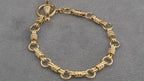 14ct yellow gold hay bale link bracelet with T-bar, 195mm
